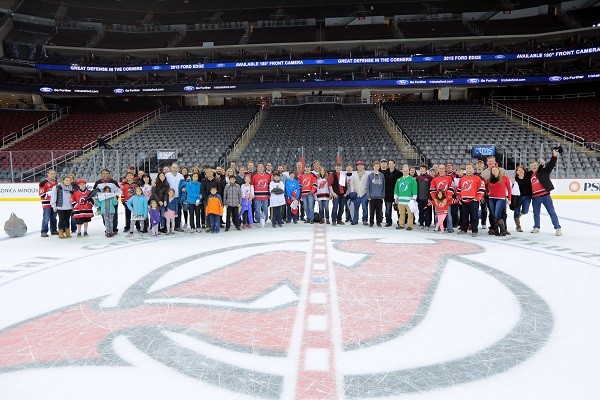 Photo: The group was able to take a photo on the ice after the game. Photo Credit: Courtesy NJ Devils