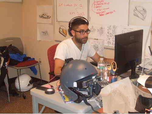 Photo: Fusar Designer Todd Rushing at work laying out the next prototype for their next gen augmented reality helmet. Photo Credit: Courtesy TechLaunch
