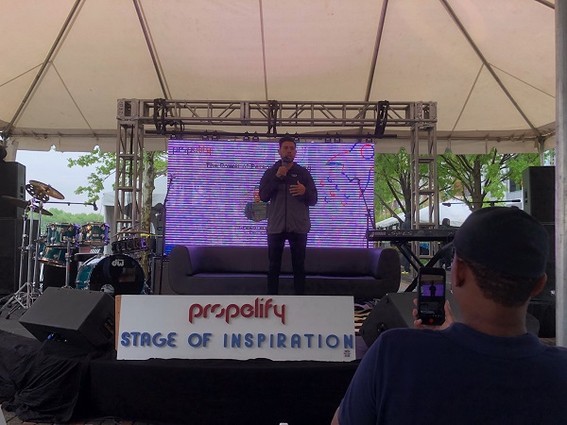 Photo: Gerard Adam addresses the crowd at the Stage of Inspiration at Propelify 2018. Photo Credit: Rob Rinderman