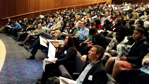 Photo: As a packed house looks on, the judges asked questions of the student presenters Photo Credit: Ellen Webner, AT&T
