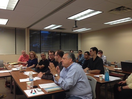 Photo: Mario Casabona and mentors listen to practice pitches at TechLaunch Photo Credit: Courtesy TechLaunch
