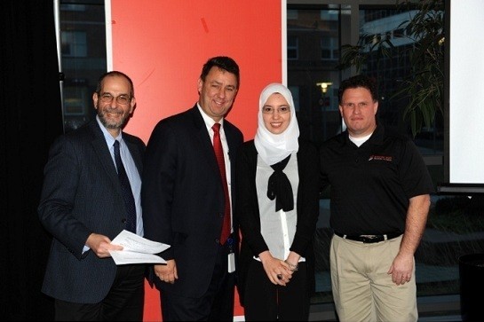 Photo: From L to R, NJIT Assistant Prof of Finance Michael Erhlich, Greg Smith, Senior VP of Group Sales, executive business banking at Capital One, Amira Essenghir and Dan Sterling, president and founder of Sterling Medical Devices. Photo Credit: Capital One