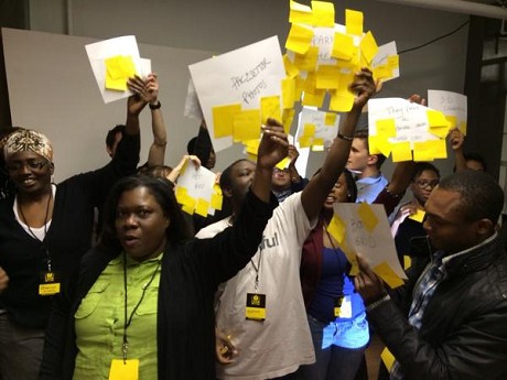 Photo: Participants in Lean Startup Machine Newark show off their votes Friday night. Photo Credit: April Peters