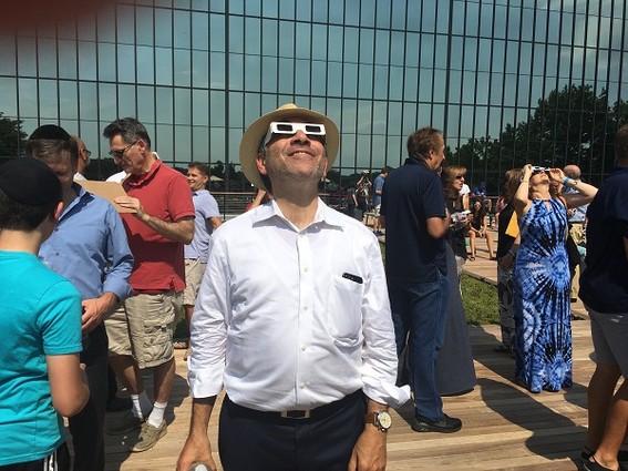 Photo: Bell Works, which has become a tech destination in Holmdel, hosted an eclipse party in August. We took many great photos that day, but the best one by far was of Ralph Zucker, president of Somerset Development, taking in the eclipse on the Bell Works terrace. To us, this photo symbolizes the return of life to the old Bell Labs space, a return of optimism for the tech industry in N.J., and the understanding that while we all work hard to build our businesses, there is always time to experience wonder. Photo Credit: Esther Surden