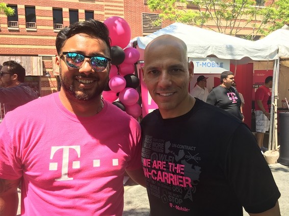 Photo: Representatives from T-Mobile outside their booth Photo Credit: Esther Surden