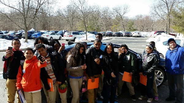 Photo: The students paused to take selfies with the GM connected car. Photo Credit: Ellen Webner, AT&T