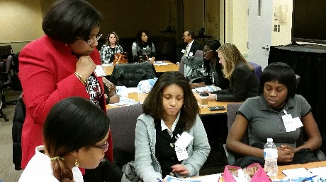 Photo: Students being mentored by employees with Joyce Henry (Network Engineering) in the front; Mercedes Morgan (Network Operations), Vere Hopper (Finance) in the background. Photo Credit: Ellen Webner, AT&T