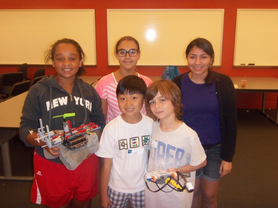 Photo: From left, Skyler Williams, Yasmine Petrocelli, Alyssa Ortiz and fellow students present their robot at the Stevens WaterBotics camp.
 Photo Credit: Alan Skontra