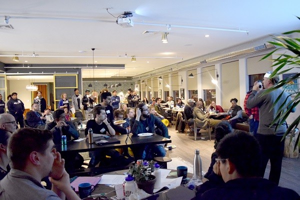 Photo: Participants at the hackathon watch demos Photo Credit: Raquel Rodriguez-Fadraga