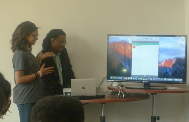 Photo: A student and Vincent Randolph demonstrate what was taught during the programming classes. Photo Credit: Courtesy Gadget Software