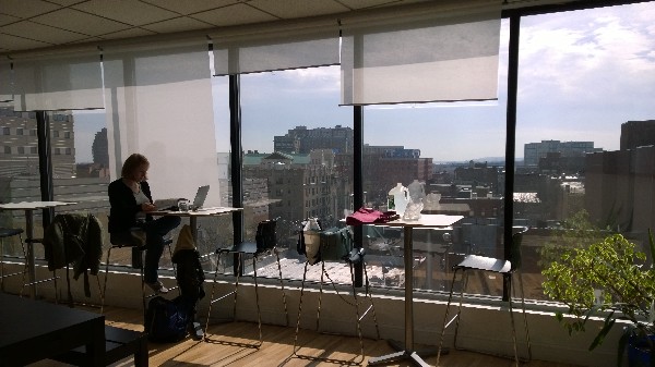 Photo: Working at tables overlooking Jersey City Photo Credit: John Critelli